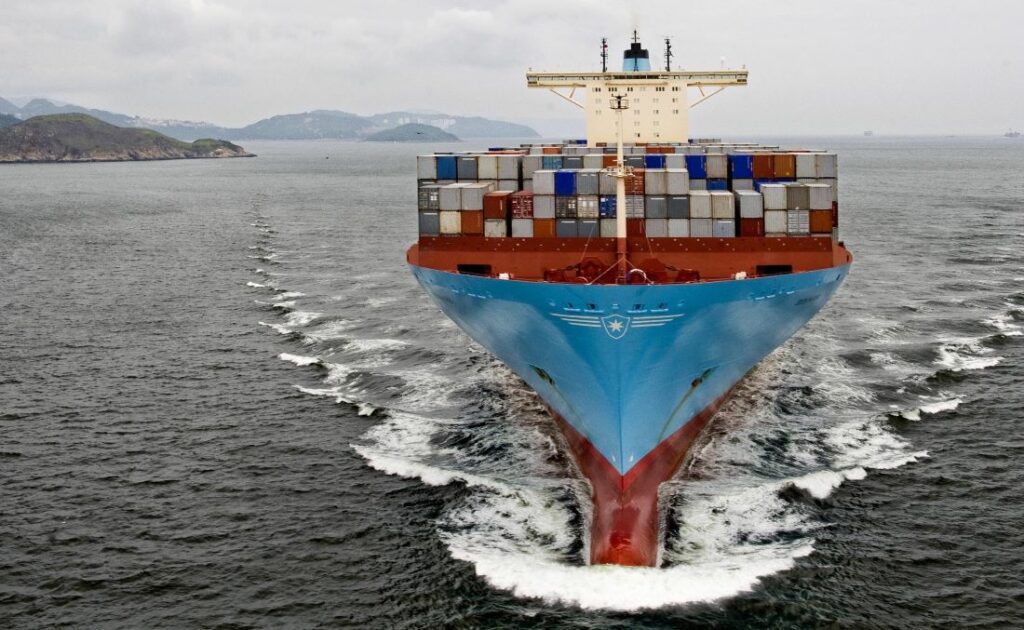 Large Container Vessel Sailing on open water close to land